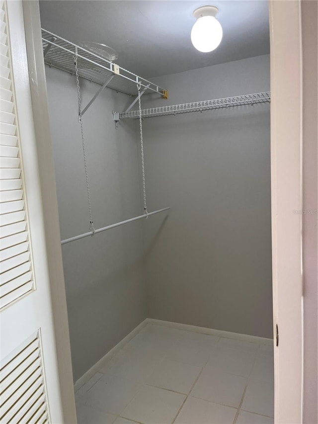 walk in closet featuring tile patterned floors