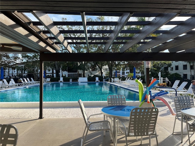 view of swimming pool with a pergola and a patio