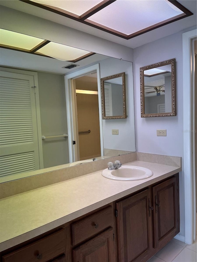 bathroom with tile patterned flooring and vanity