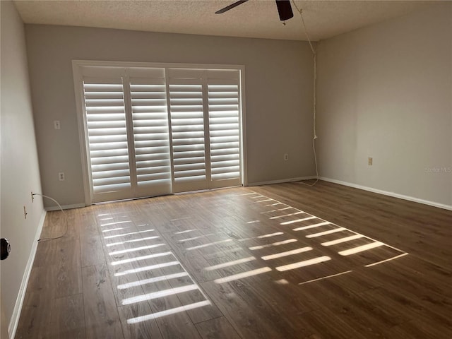 spare room with a textured ceiling, hardwood / wood-style flooring, and ceiling fan