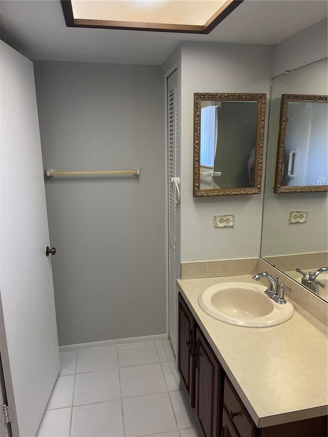 bathroom featuring tile patterned floors and vanity