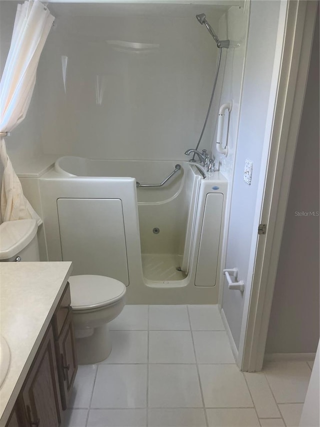 2593 Countryside Blvd Unit 7213, Clearwater, FL 33761 - bathroom with a shower, tile patterned flooring, and vanity