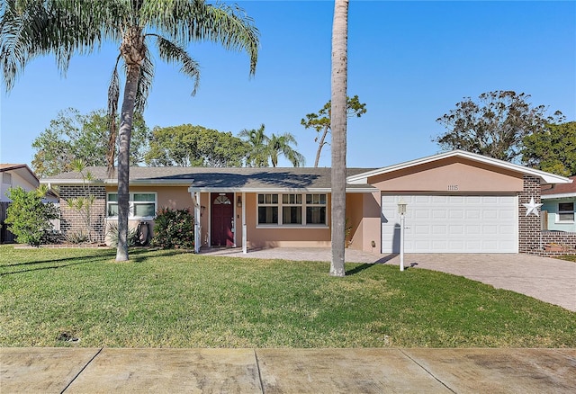 ranch-style home with a garage and a front yard