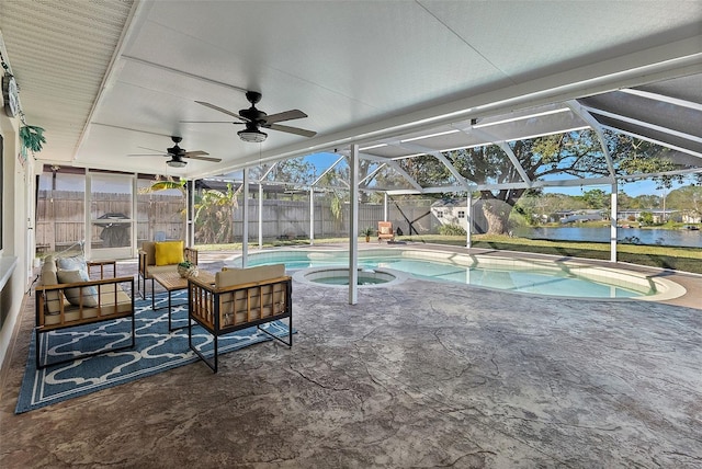 view of swimming pool featuring outdoor lounge area, a lanai, a patio area, an in ground hot tub, and a water view