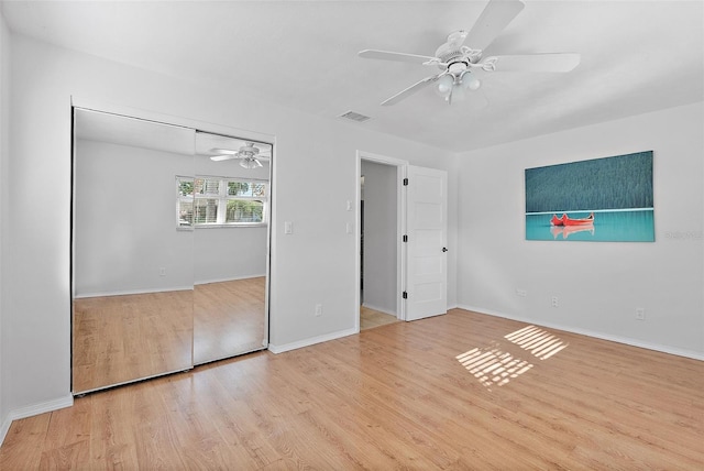 spare room with light hardwood / wood-style flooring and ceiling fan