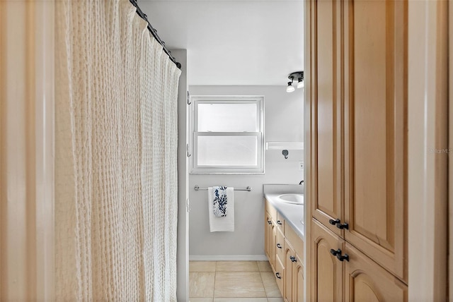 bathroom with tile patterned flooring and vanity