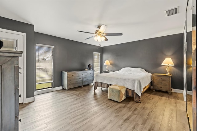 bedroom featuring light hardwood / wood-style floors and ceiling fan