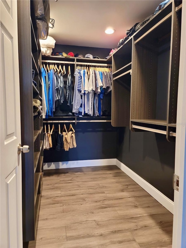 spacious closet featuring hardwood / wood-style floors