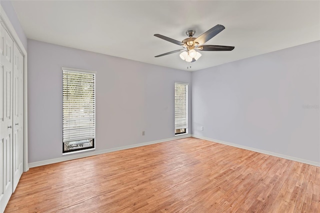 empty room featuring ceiling fan and light wood-type flooring