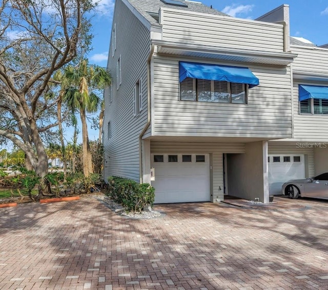 view of front of property with a garage