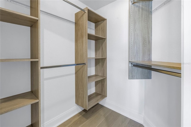 walk in closet featuring hardwood / wood-style floors