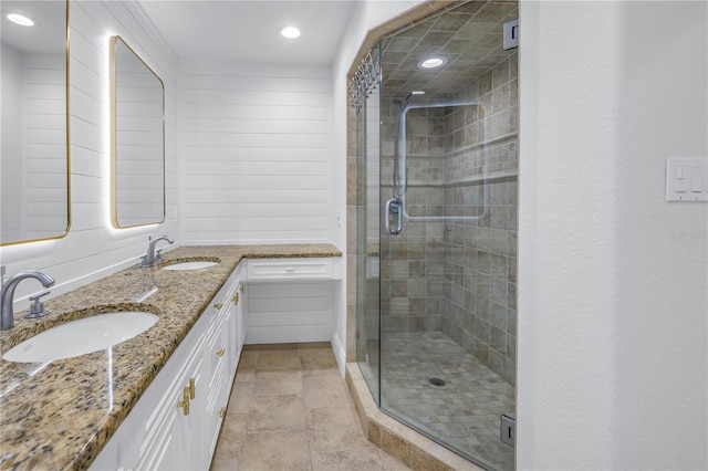 bathroom featuring vanity and a shower with shower door