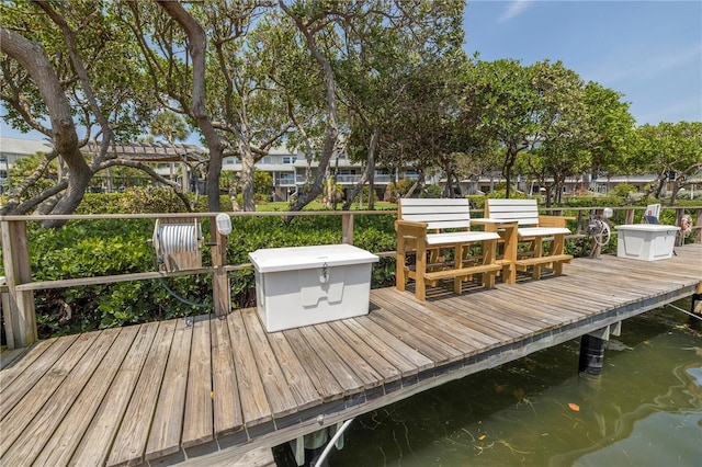 wooden terrace featuring a water view