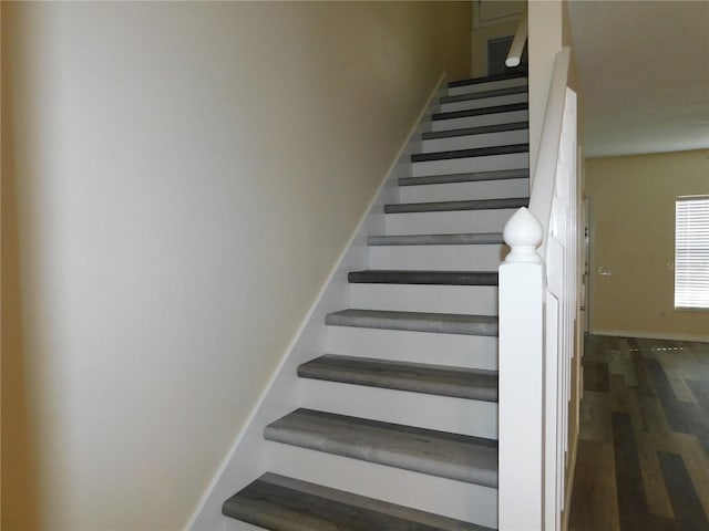 stairs with wood-type flooring