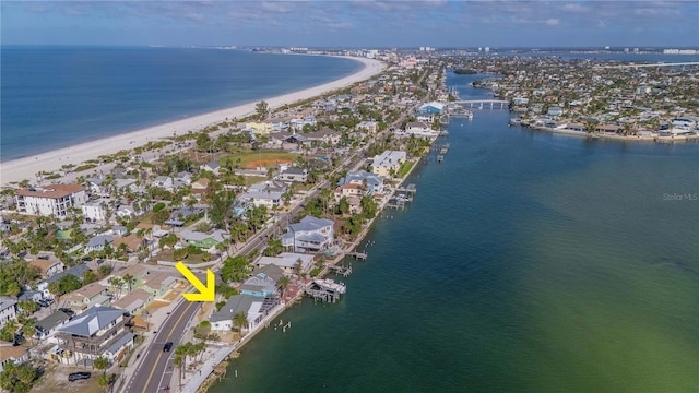 aerial view with a water view and a view of the beach