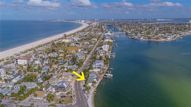 aerial view with a water view and a view of the beach