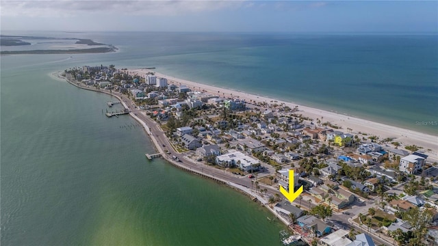 birds eye view of property featuring a water view and a view of the beach