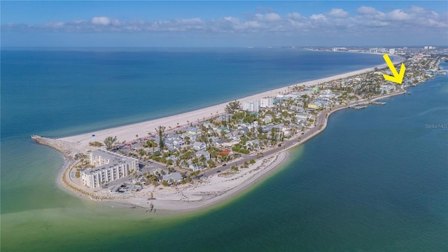 bird's eye view featuring a water view and a view of the beach