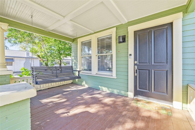 property entrance with covered porch