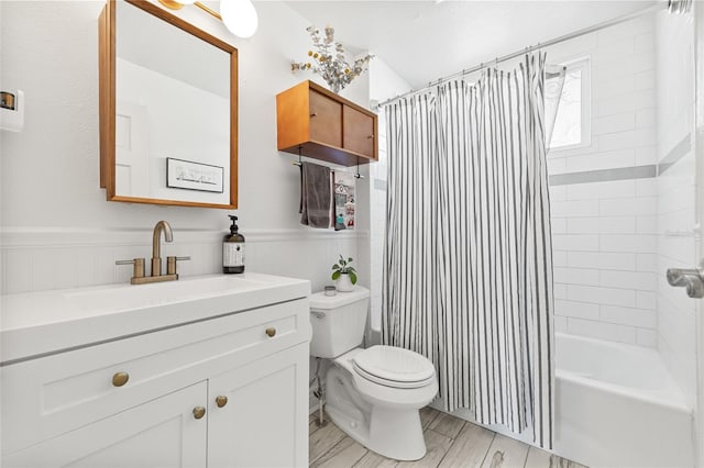 full bathroom with vanity, shower / bathtub combination with curtain, and toilet