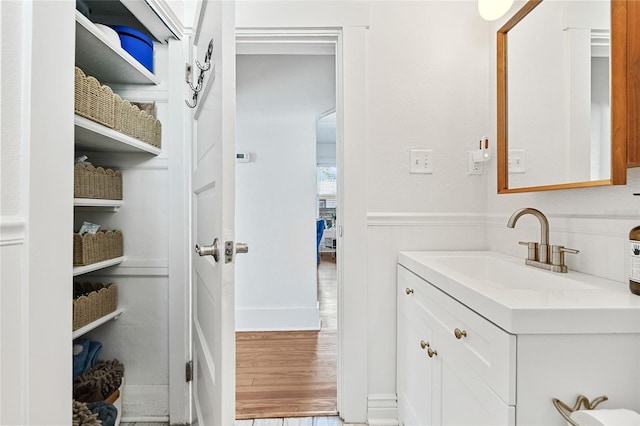 bathroom featuring vanity and wood-type flooring