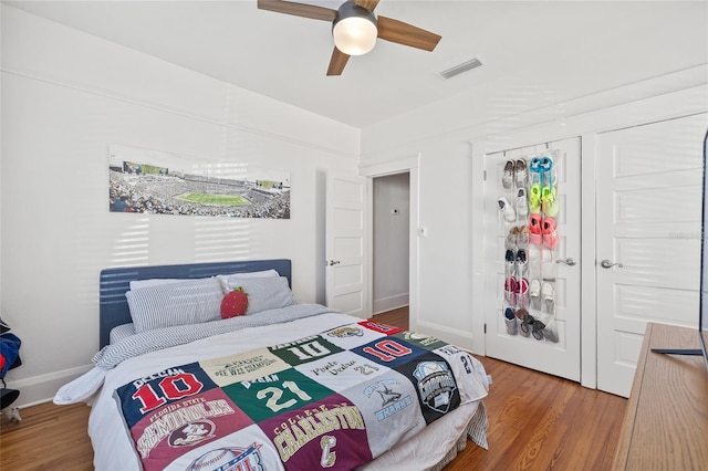 bedroom featuring hardwood / wood-style flooring and ceiling fan