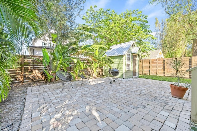 view of patio featuring an outdoor structure