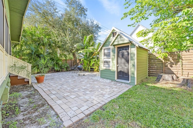 view of outbuilding with a lawn