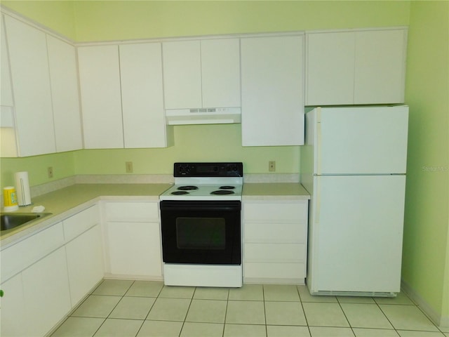 kitchen featuring sink, white cabinets, light tile patterned flooring, and white appliances