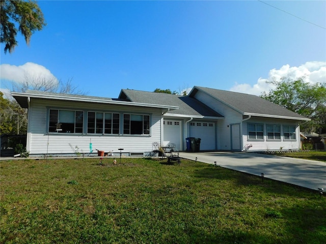 ranch-style home with a front yard and a garage