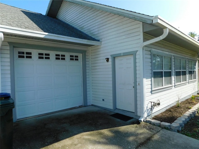 view of property exterior with a garage