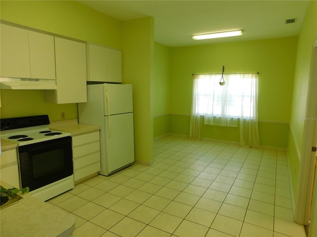 kitchen featuring white cabinetry, light tile patterned floors, and white appliances