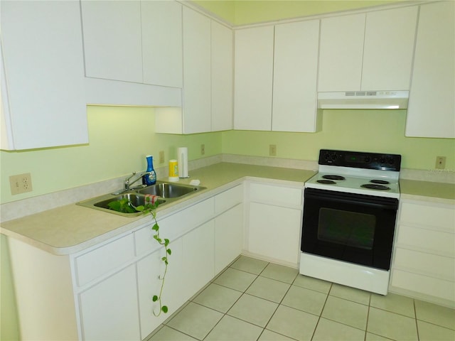 kitchen featuring electric range, white cabinets, light tile patterned floors, and sink