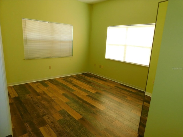 spare room featuring dark hardwood / wood-style floors