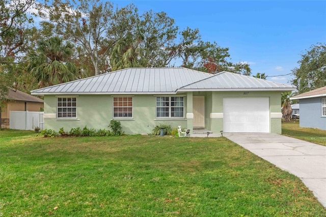 ranch-style house featuring a garage and a front lawn