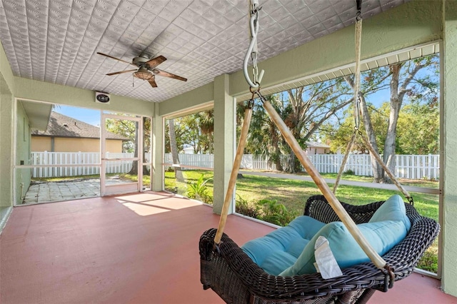 sunroom with a ceiling fan