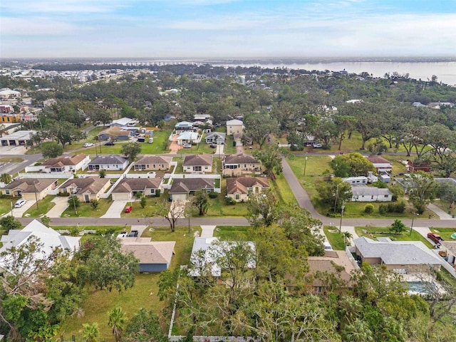 bird's eye view with a residential view and a water view