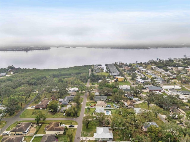 birds eye view of property with a water view and a residential view