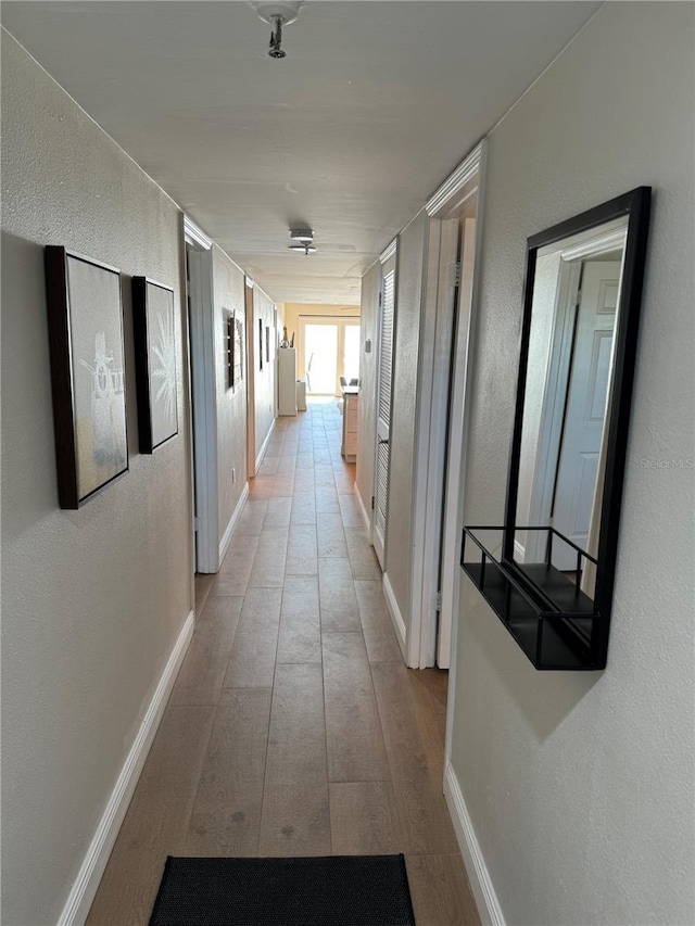 corridor featuring light hardwood / wood-style floors