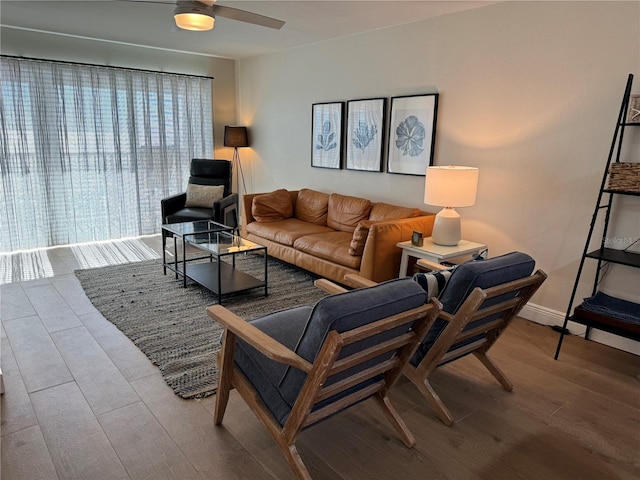 living room featuring light hardwood / wood-style floors and ceiling fan