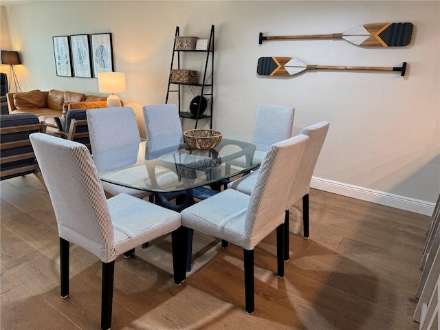 dining space featuring hardwood / wood-style floors