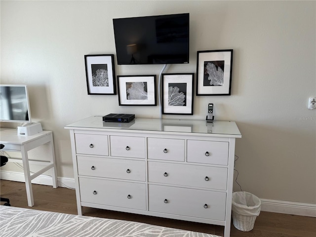 bedroom featuring dark wood-type flooring