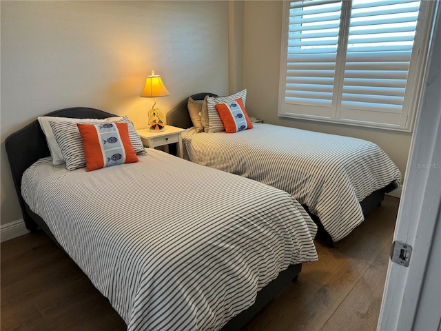 bedroom featuring dark wood-type flooring