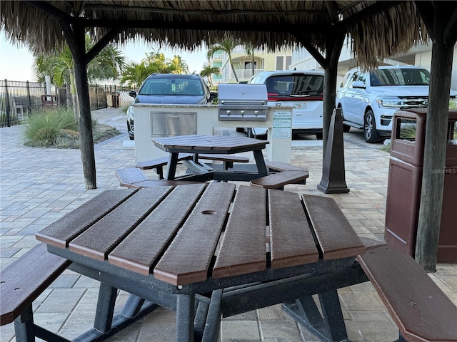 exterior space with an outdoor kitchen and a patio