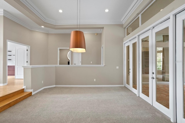 spare room featuring carpet, french doors, and ornamental molding