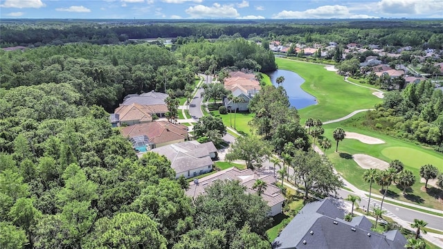 10106 Radcliffe Dr, Tampa, FL 33626 - aerial overview of property's location with a golf club, a nearby body of water, nearby suburban area, and a heavily wooded area