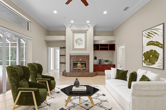 10106 Radcliffe Dr, Tampa, FL 33626 - living room with light tile patterned floors, ceiling fan, crown molding, recessed lighting, and a premium fireplace