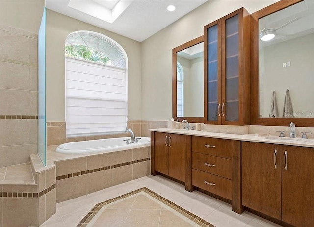 10106 Radcliffe Dr, Tampa, FL 33626 - bathroom featuring tile patterned flooring, double vanity, and a garden tub