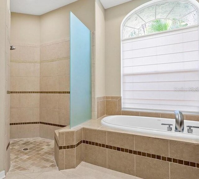 10106 Radcliffe Dr, Tampa, FL 33626 - full bath with a garden tub, a walk in shower, and tile patterned floors
