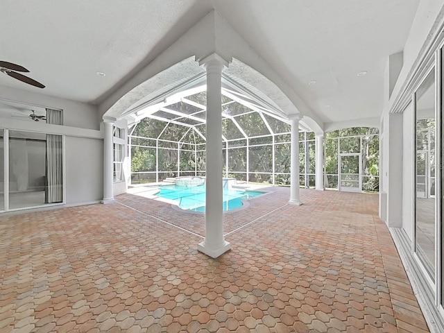 10106 Radcliffe Dr, Tampa, FL 33626 - view of swimming pool featuring a ceiling fan, a pool with connected hot tub, a lanai, and a patio area